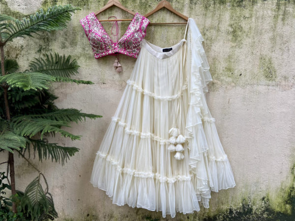 Ivory and Fuchsia Tier and Ruffle Lehenga Set Black Thread Co Ivory and Fuchsia Tier and Ruffle Lehenga Set Black Thread Co